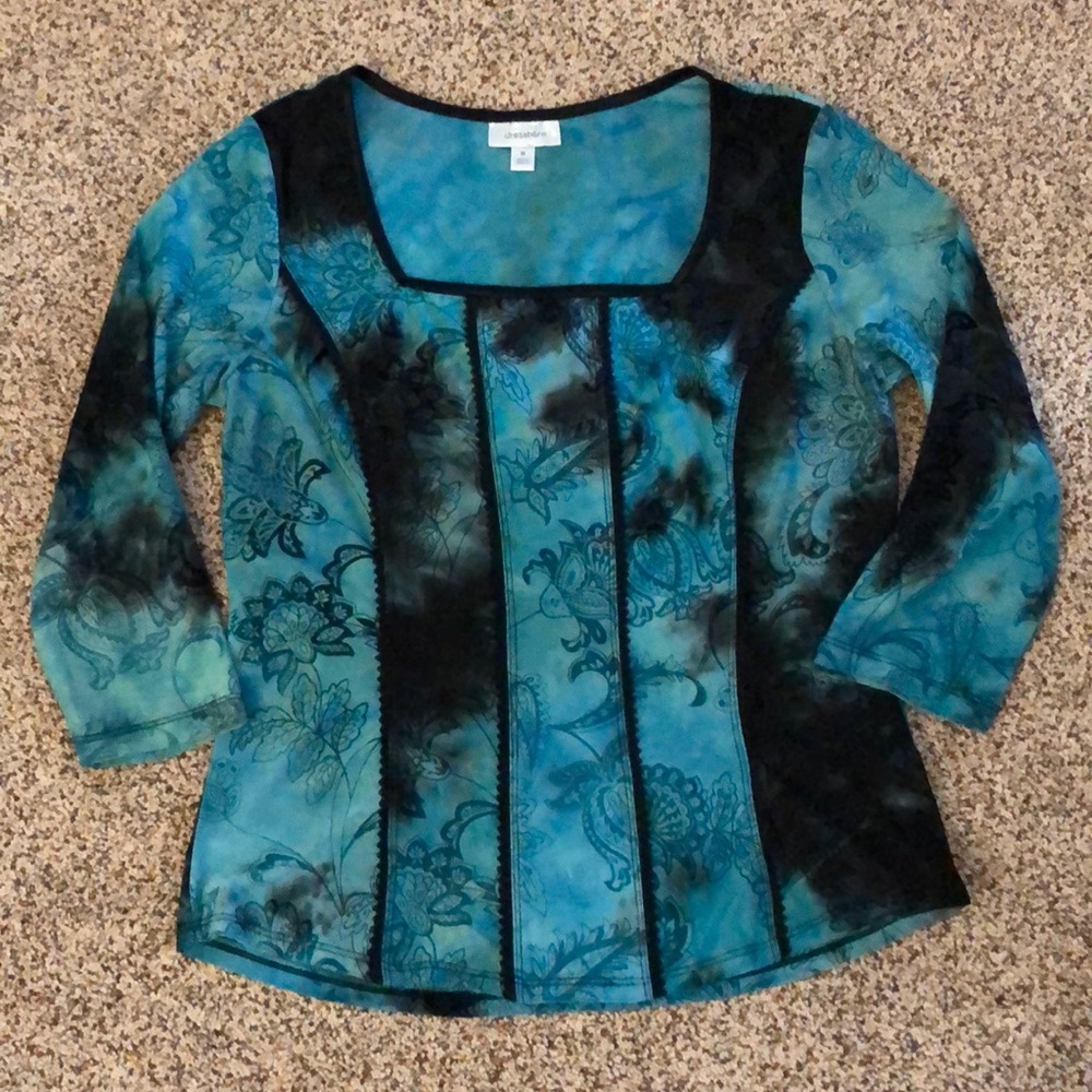 Turquoise and black top.